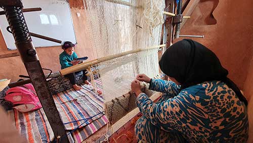 The Berber carpet woven in family